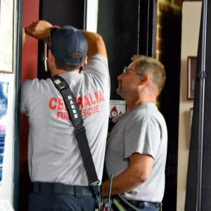 Sentinel Photo/JO ALLEN ELEVATOR RESCUE — Centralia Fire Department Captain Scott Wiesen and Fireman Kelton Harre rescue three trapped men from a stalled elevator at the Centralia Area Historical Museum late Saturday morning. No injuries were reported and all three men were rescued without further incident. The elevator will be undergoing inspection and maintenance before opening again. 